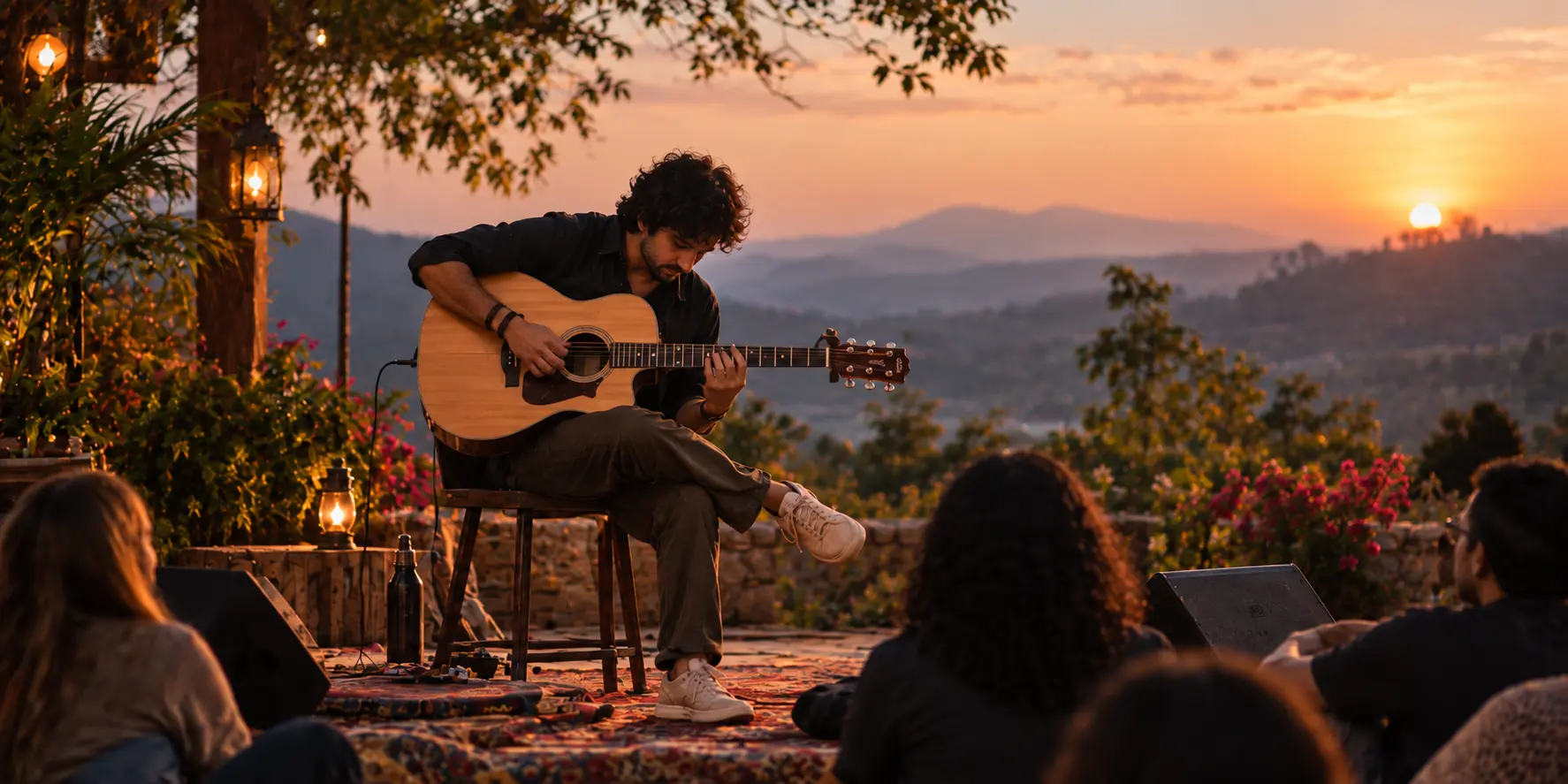 Acoustic guitarist performing outdoors at sunset